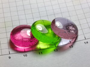 beads of Neodymium, Praseodymium and Erbium doped glass